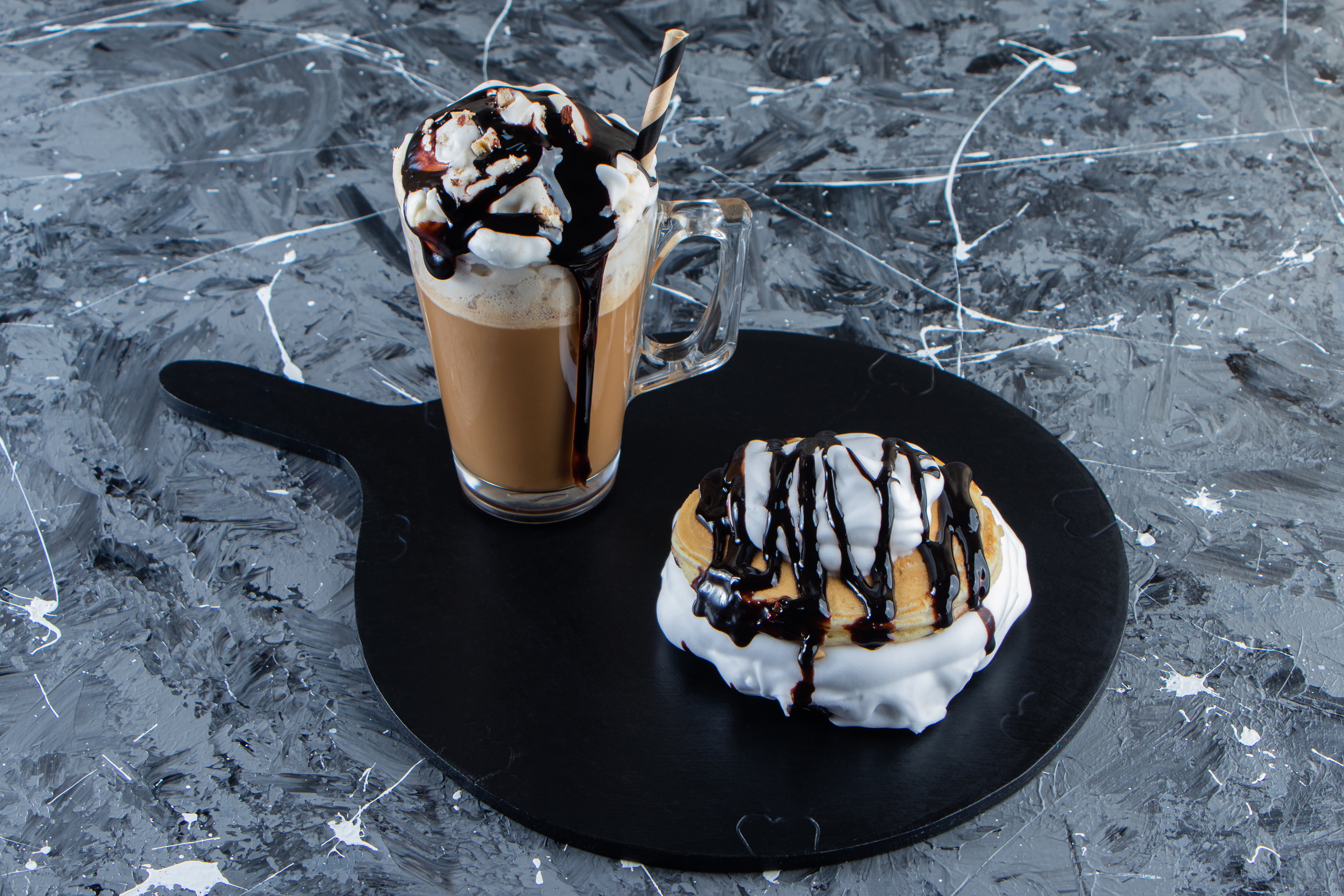 pancakes-with-chocolate-topping-glass-coffee-wooden-board